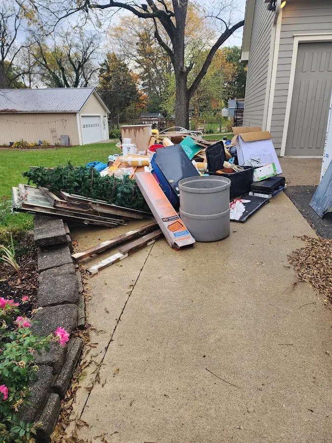 Dumpster being loaded with debris for Demolition Dumpster Rental in North Kingstown